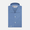 View 1 of product The Turnbull & Asser Tailored Fit Deep Blue Cotton Shirt features a classic Kent collar and 2-button cuffs, shown neatly folded with white buttons against a plain white background.
