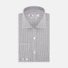 View 1 of product A neatly folded Turnbull & Asser Tailored Fit Grey and White Small Check Shirt with a Kent collar and 2-button cuffs is shown, featuring its brand label inside the collar.