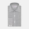 View 1 of product Turnbull & Asser’s Tailored Fit Grey End-On-End Shirt features a classic Kent collar, white buttons, and 2-button cuffs. This long-sleeved shirt is displayed neatly folded against a plain white background.