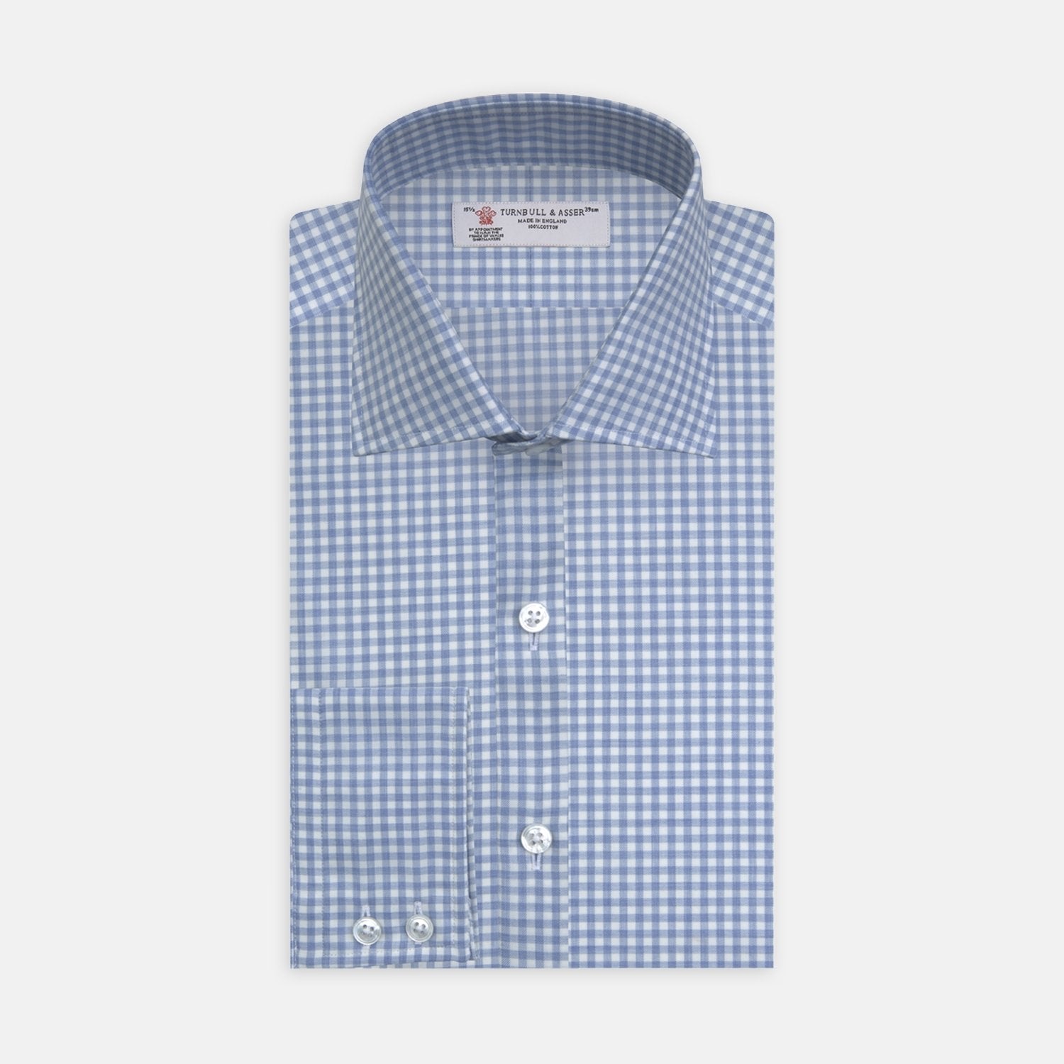 View 2 of product A circular swatch of Turnbull & Asser's Light Blue Gingham Cotton Fabric, featuring a blue and white checkered pattern with a thin gray border, displayed against a plain light background.
