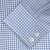 View 2 of product The Turnbull & Asser Tailored Fit Light Blue Gingham Shirt features a Kent collar, 2-button cuffs, and a small blue-and-white checkered pattern, shown on a white background.