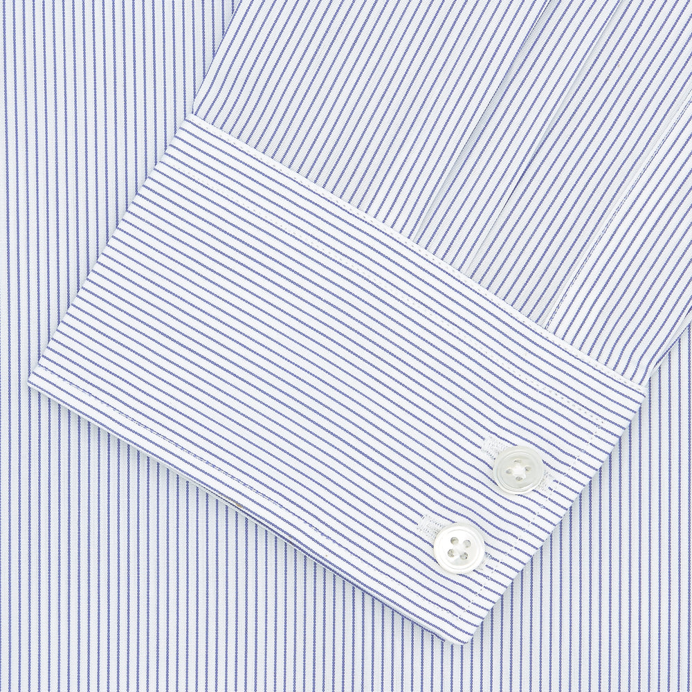 The Turnbull & Asser Tailored Fit Blue and White Fine Stripe Shirt features a Kent collar and 2-button cuffs, shown neatly folded against a plain white background.