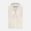 View 1 of product The Turnbull & Asser Weekend Fit Cream Herringbone Western Shirt features a Norfolk collar, button cuffs, and chest pockets, elegantly folded and displayed on a plain white background.