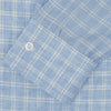 View 2 of product The Turnbull & Asser Weekend Fit Blue Plaid Linen Shirt features a white check pattern, Derby collar, long sleeves with 1-button cuffs, single chest pocket, and button-up front, shown against a white background.