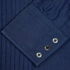 View 5 of product A neatly folded Turnbull & Asser Dark Blue Denim-Cashmere Dress Shirt with T&A collar and 3-button cuffs, showcased on a plain light background, offers a refined formal alternative.