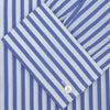View 2 of product The Turnbull & Asser Blue and White Candy Stripe Shirt features a Regent collar, double cuffs, and white buttons, neatly folded against a plain white background.