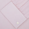 View 4 of product The Turnbull & Asser Pink Hairline Stripe Cotton Shirt features a T&A collar, double cuffs, neat vertical stripes, white buttons, and a chest pocket—perfect for the office. Shown neatly folded on a plain white background.