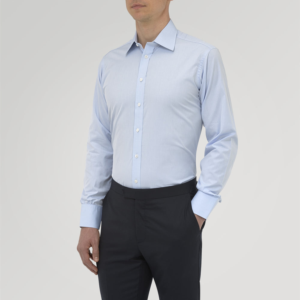 The Turnbull & Asser Blue West Indian Sea Island Cotton Shirt features a T&A collar, 3-button cuffs, white buttons, a front chest pocket, and a monogrammed label inside the collar.