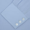 View 2 of product The Turnbull & Asser Blue Sea Island Quality Cotton Shirt features a Dr. No collar and button cuffs, crafted from fine cotton and shown neatly folded on a plain white background.