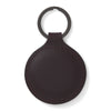 View 2 of product The Violla Leather Key Fob by Turnbull & Asser is a round, dark brown leather accessory with embossed branding, visible edge stitching, and a metal loop at the top. Made in England, it combines elegance and function for your keys.