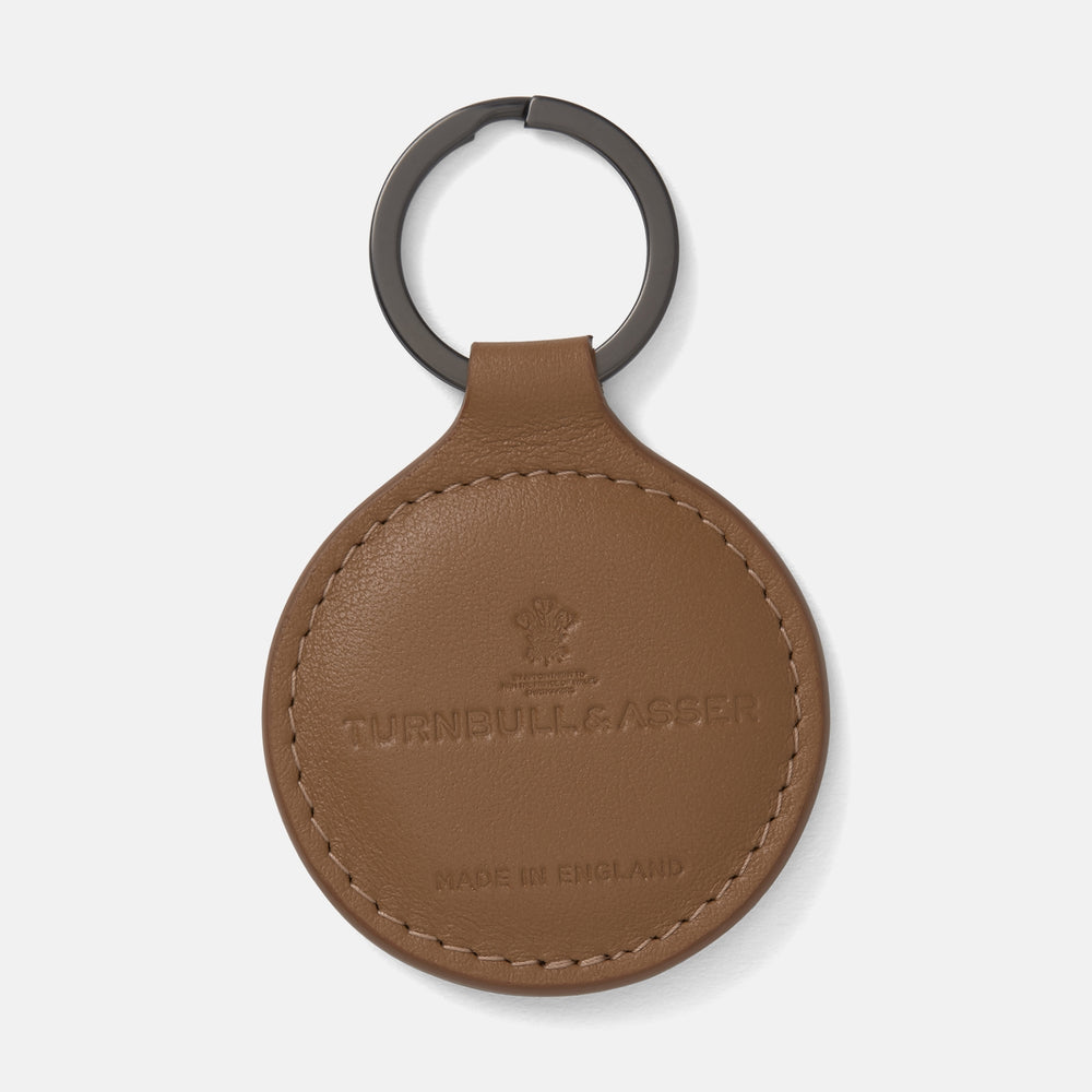 The Peanut Brown Leather Key Fob by Turnbull & Asser features embossed branding, MADE IN ENGLAND details, and a dark metal keyring.
