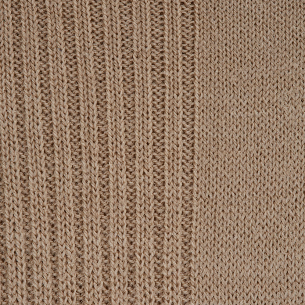 An Ecru Mid-Length Merino Wool Sock by Turnbull & Asser stands upright on a light gray background, showing both the heel and toe.