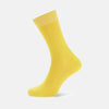 View 1 of product A single Yellow Short Cotton Sock by Turnbull & Asser, crafted from soft Egyptian cotton with ribbed texture and solid yellow cuff, heel, and toe, stands upright on a plain white background—a staple for any luxury sock collection.