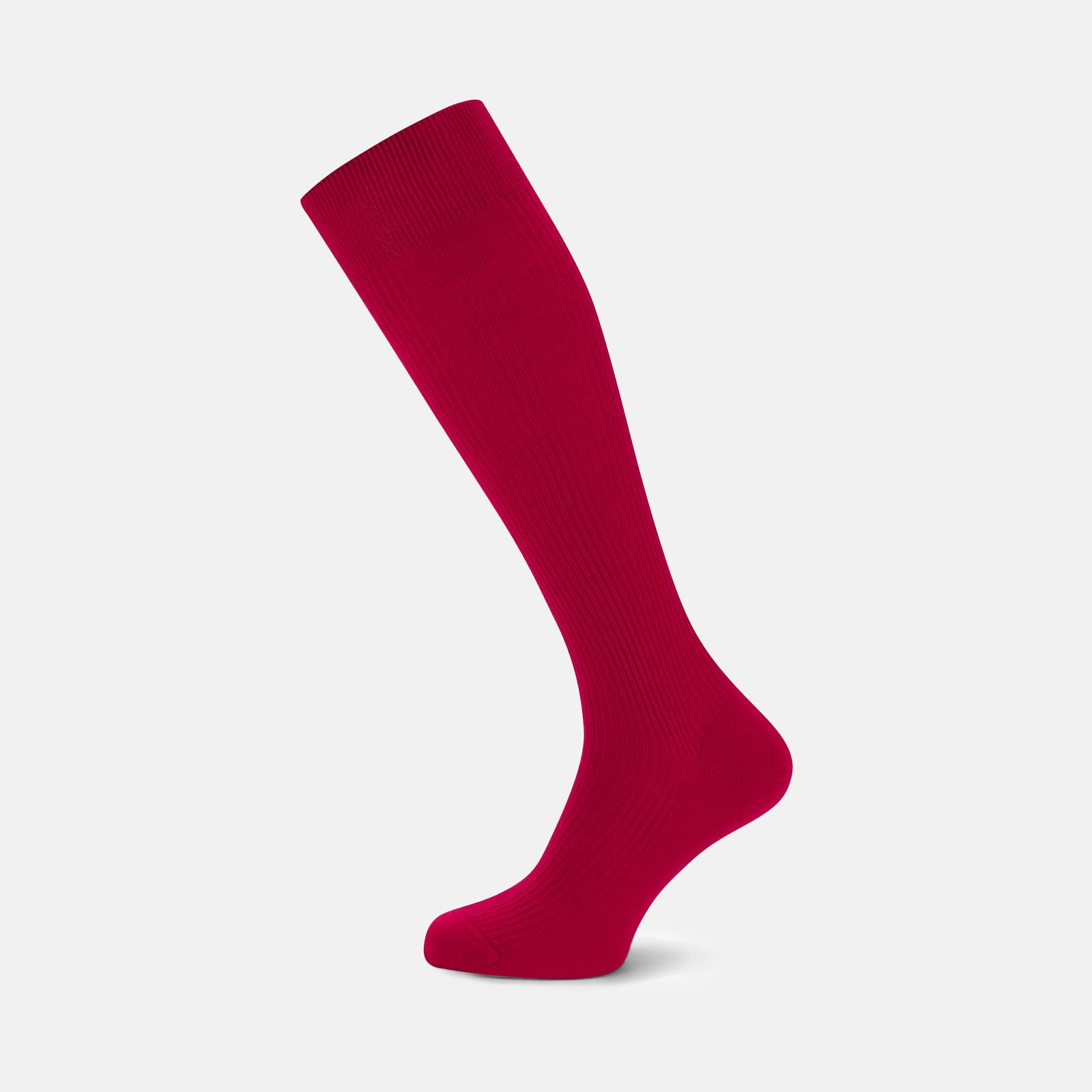 View 1 of product A single Red Long Merino Wool Sock by Turnbull & Asser stands upright against a light gray background, highlighting the elegance and luxury of premium men’s socks.