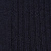 View 2 of product A single Deep Navy Long Merino Wool Sock by Turnbull & Asser is shown on a mannequin leg against a plain light gray background.
