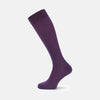 View 1 of product A single Purple Long Merino Wool Sock by Turnbull & Asser is showcased on a foot-shaped mannequin against a white background, highlighting the luxurious craftsmanship of premium men’s socks.