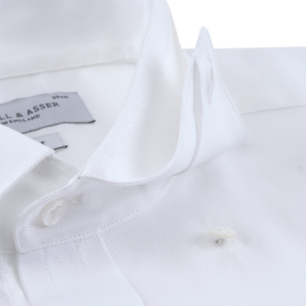 Turnbull & Asser's Tailored Fit Blue and White Stripe Linen Shirt features wide vertical stripes, a concealed button-down collar, and button cuffs—perfect for spring style.