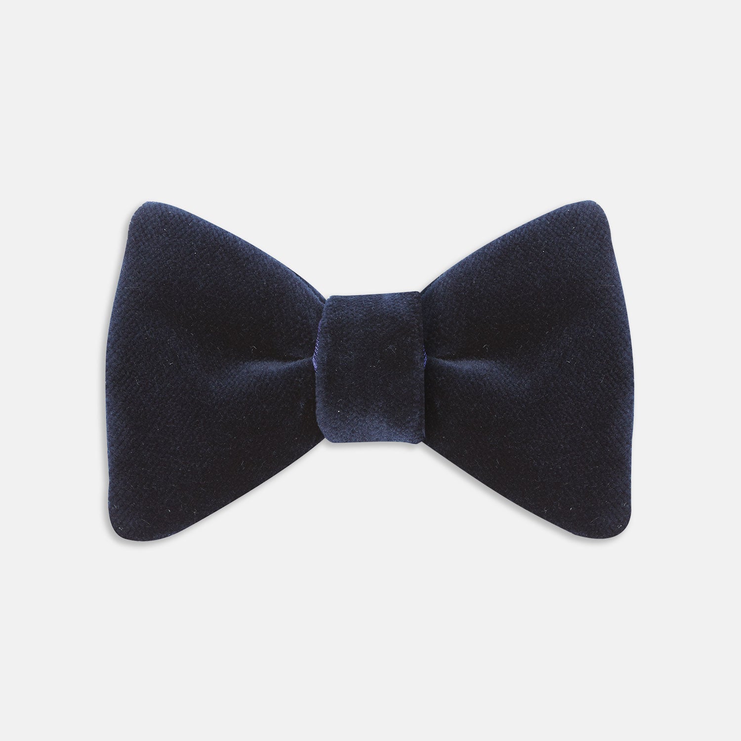 View 1 of product The Turnbull & Asser Navy Velvet Bow Tie, crafted from plush velvet, is shown against a white background—an elegant choice for formal occasions.