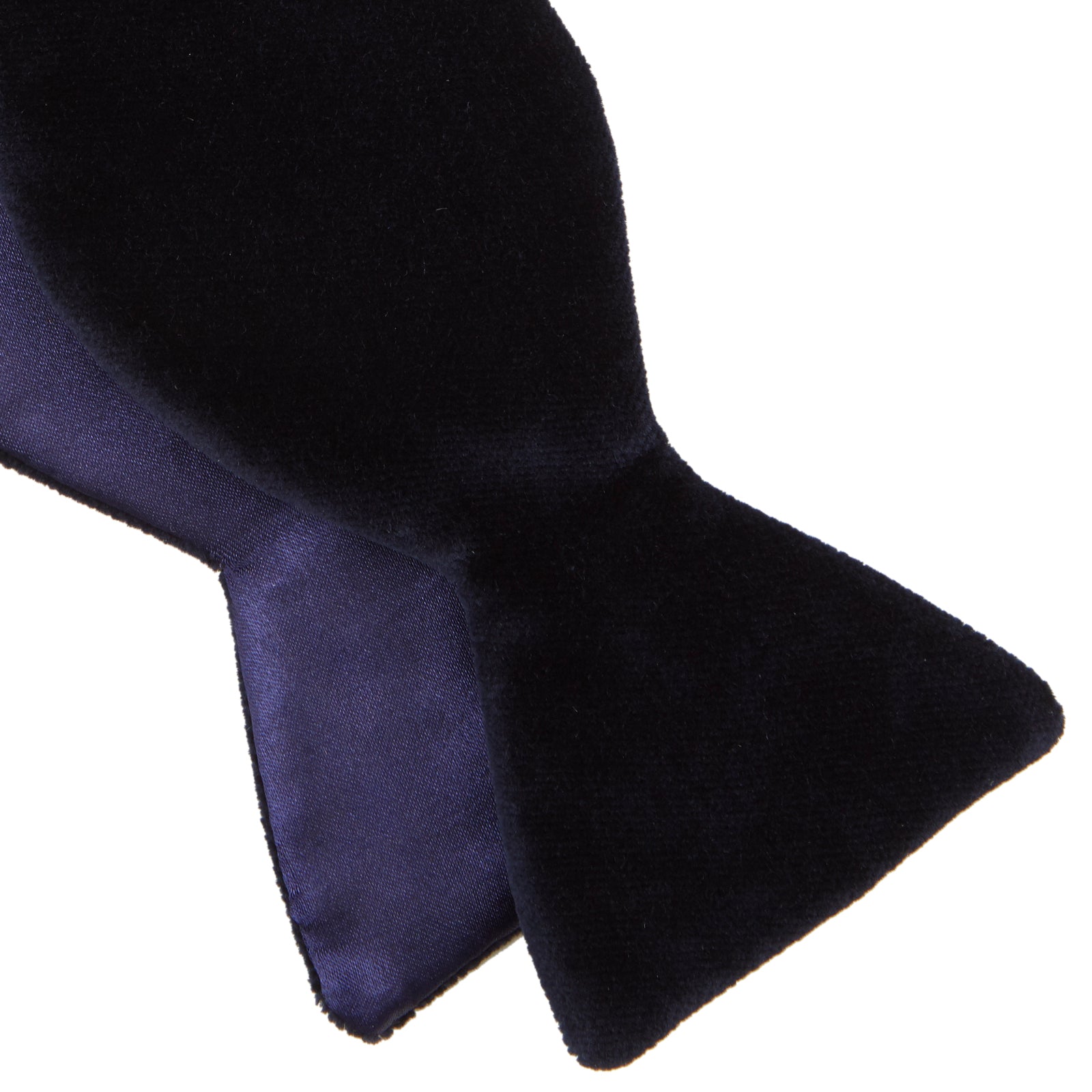 View 4 of product The Turnbull & Asser Navy Velvet Bow Tie, crafted from plush velvet, is shown against a white background—an elegant choice for formal occasions.