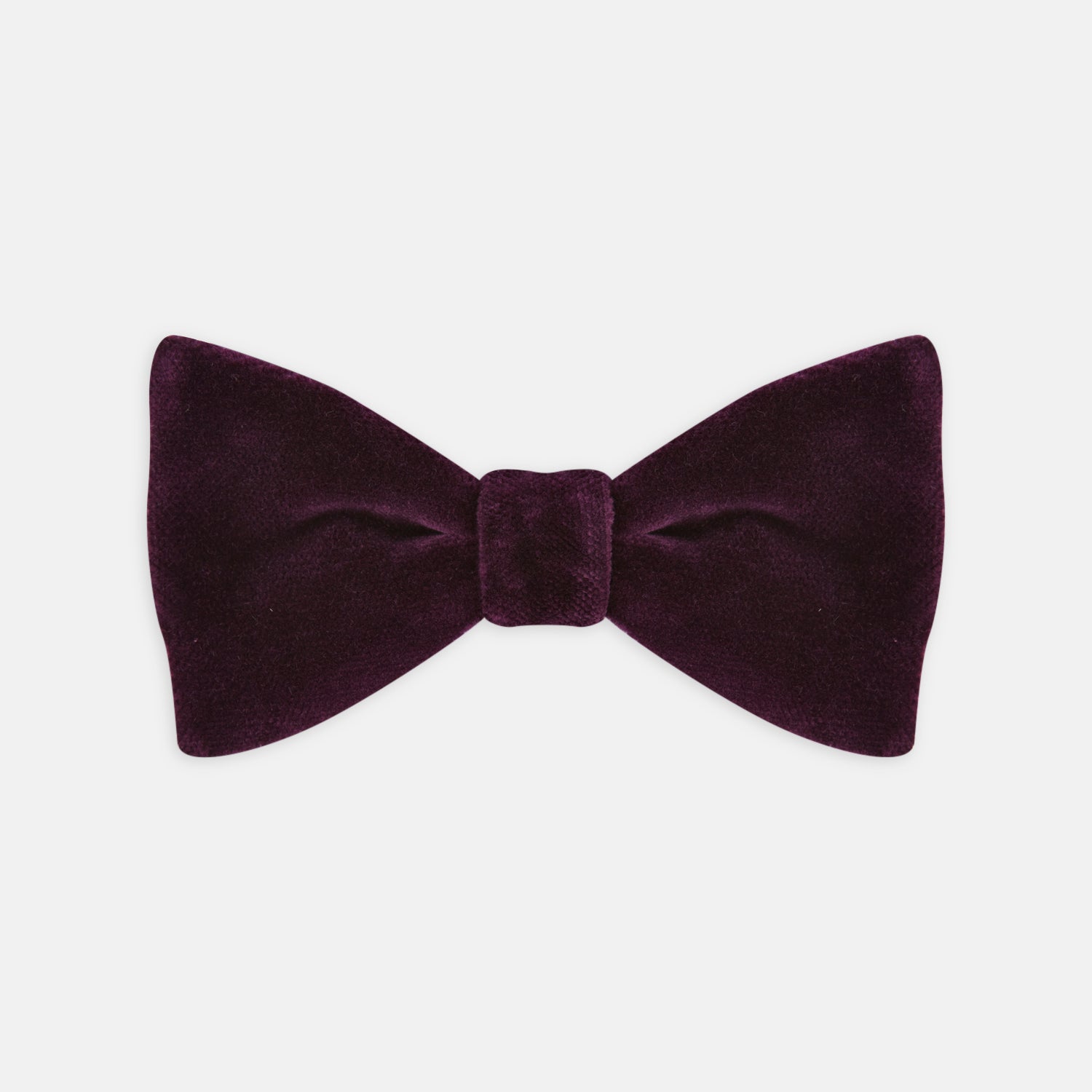 View 1 of product The Turnbull & Asser Purple Velvet Bow Tie is showcased on a plain white background, offering an elegant accessory to elevate any formal outfit with sophistication.