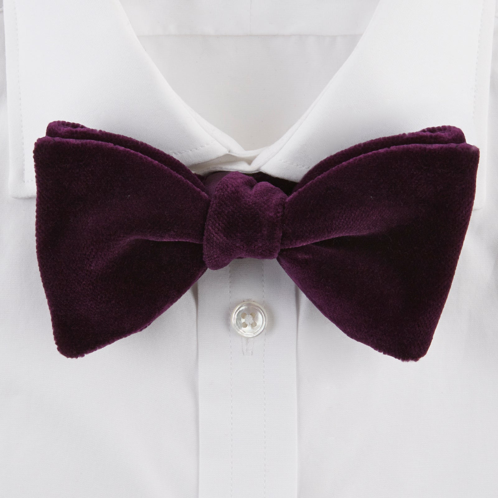 View 2 of product The Turnbull & Asser Purple Velvet Bow Tie is showcased on a plain white background, offering an elegant accessory to elevate any formal outfit with sophistication.