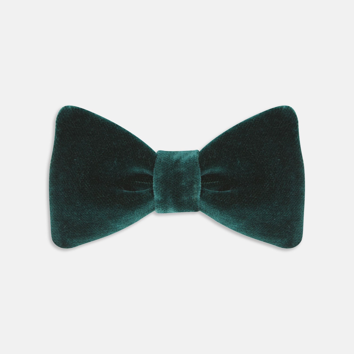 View 1 of product The Turnbull & Asser Green Velvet Bow Tie features a rich dark green hue and plush, smooth texture, ideal for formal events. Shown here against a plain white background.