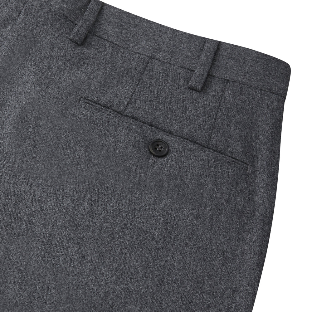 The Turnbull & Asser Charcoal Flannel Trousers feature a tailored fit, button and zipper closure, front pockets, and belt loops, crafted from fine Italian wool flannel and displayed flat on a white background.