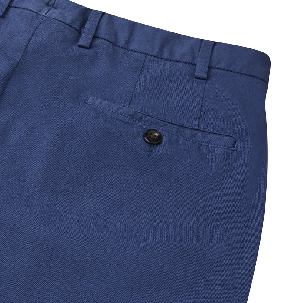 Turnbull & Asser’s Navy Garment Dyed Cotton Chinos feature a slim, straight-leg fit, belt loops, button closure, and side pockets—shown here against a plain white background.
