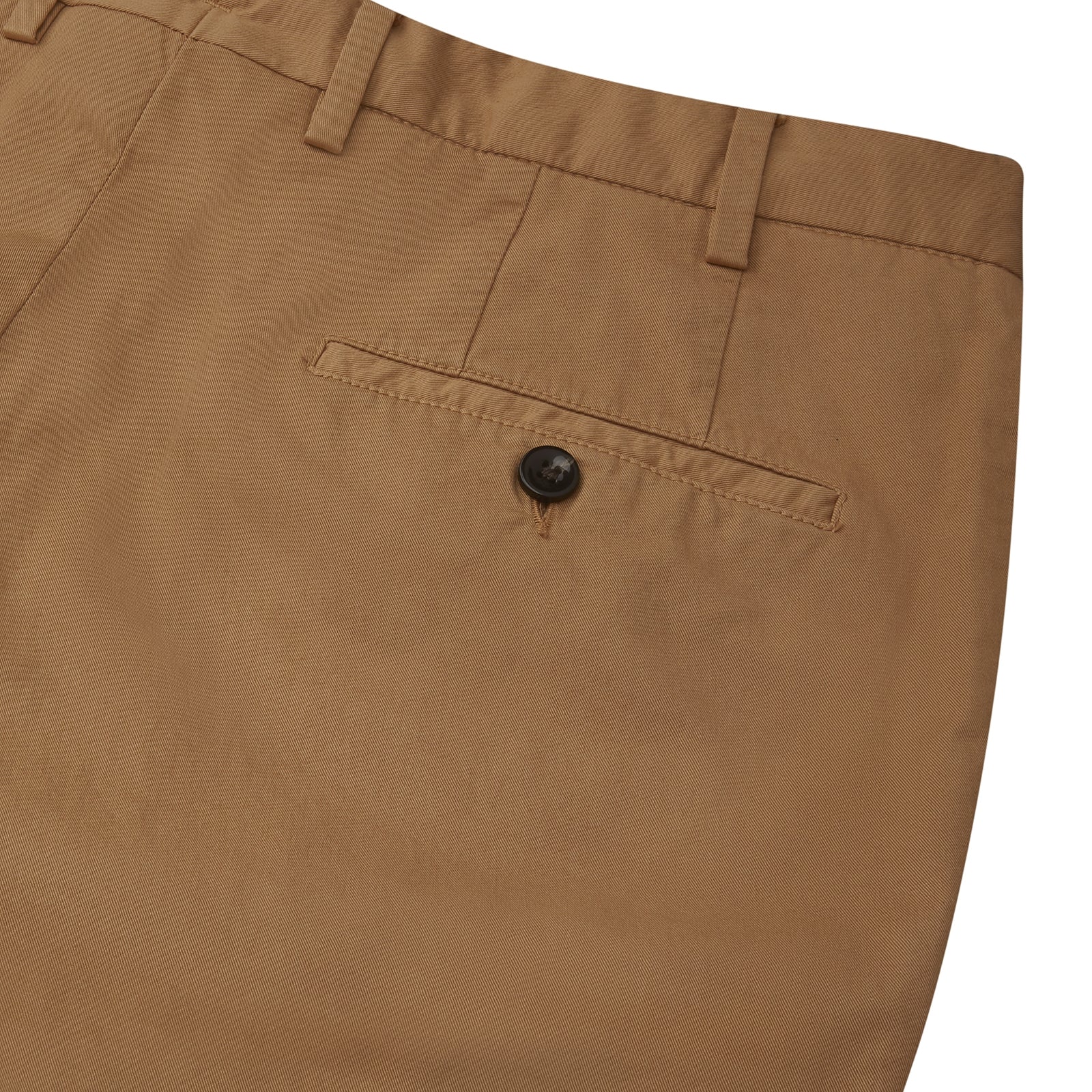 View 2 of product The Tan Garment Dyed Cotton Chinos from Turnbull & Asser, crafted from Italian cotton twill with belt loops, front pockets, and a button closure, are shown laid flat on a white background.