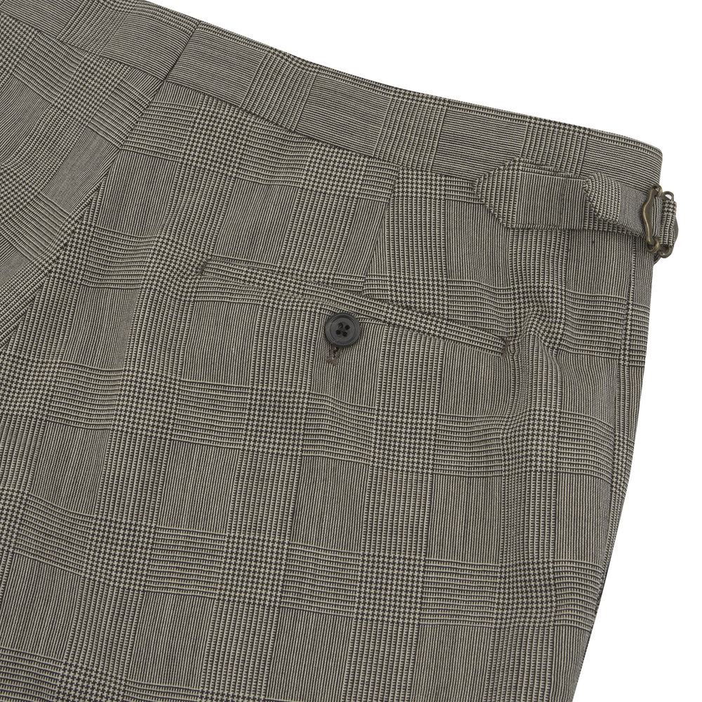 Turnbull & Asser’s Harry Grey Check Trousers feature a slim fit, flat front, and straight legs in a refined check pattern—an elegant seasonal update for your wardrobe, shown here against a white background.