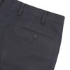 View 2 of product The Turnbull & Asser Jackson Navy Wool Trousers are tailored formal trousers in dark navy, featuring a button and zip closure, front pockets, and belt loops, shown against a plain white background.
