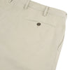 View 2 of product Turnbull & Asser's Stone Cotton Twill Pleated Trousers feature a relaxed fit, front pleats, side pockets, belt loops, and button closure, shown laid flat on a white background.