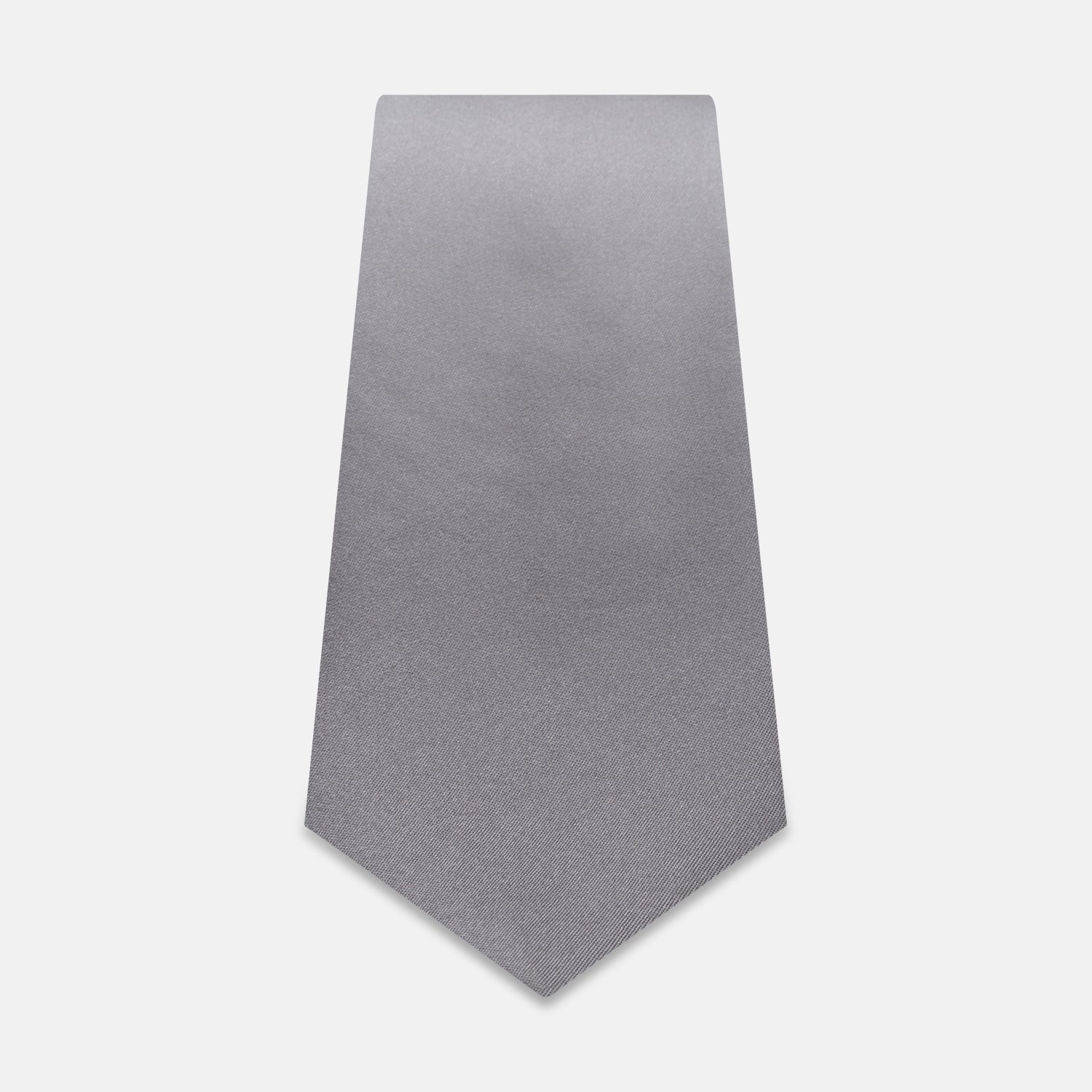 View 2 of product The Grey Satin Silk Tie by Turnbull & Asser is displayed vertically against a white background—its solid light grey silk and satin finish make it an elegant choice for a spring wedding.