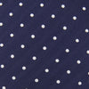 View 3 of product The Turnbull & Asser Slim Navy & White Spot Herringbone Silk Tie features a subtle texture and white polka dots, making it a refined men's accessory. Shown rolled-up on a plain white background.