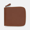 View 1 of product The Light Tan Leather 8 C/C Zipped Wallet by Turnbull & Asser, with a smooth square design, features a leather pull tab and zipper along two sides. It is shown closed against a plain white background.