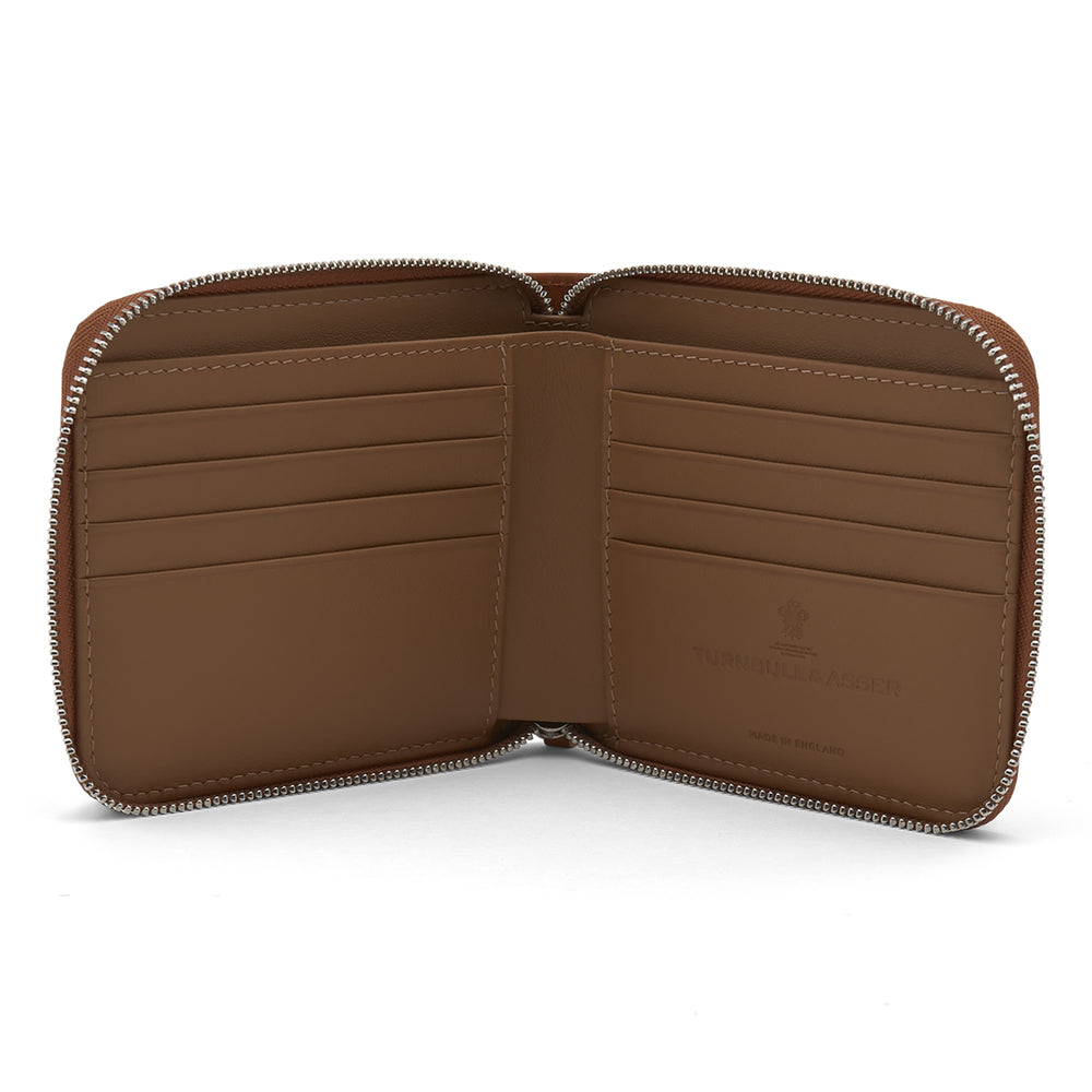 The Light Tan Leather 8 C/C Zipped Wallet by Turnbull & Asser, with a smooth square design, features a leather pull tab and zipper along two sides. It is shown closed against a plain white background.